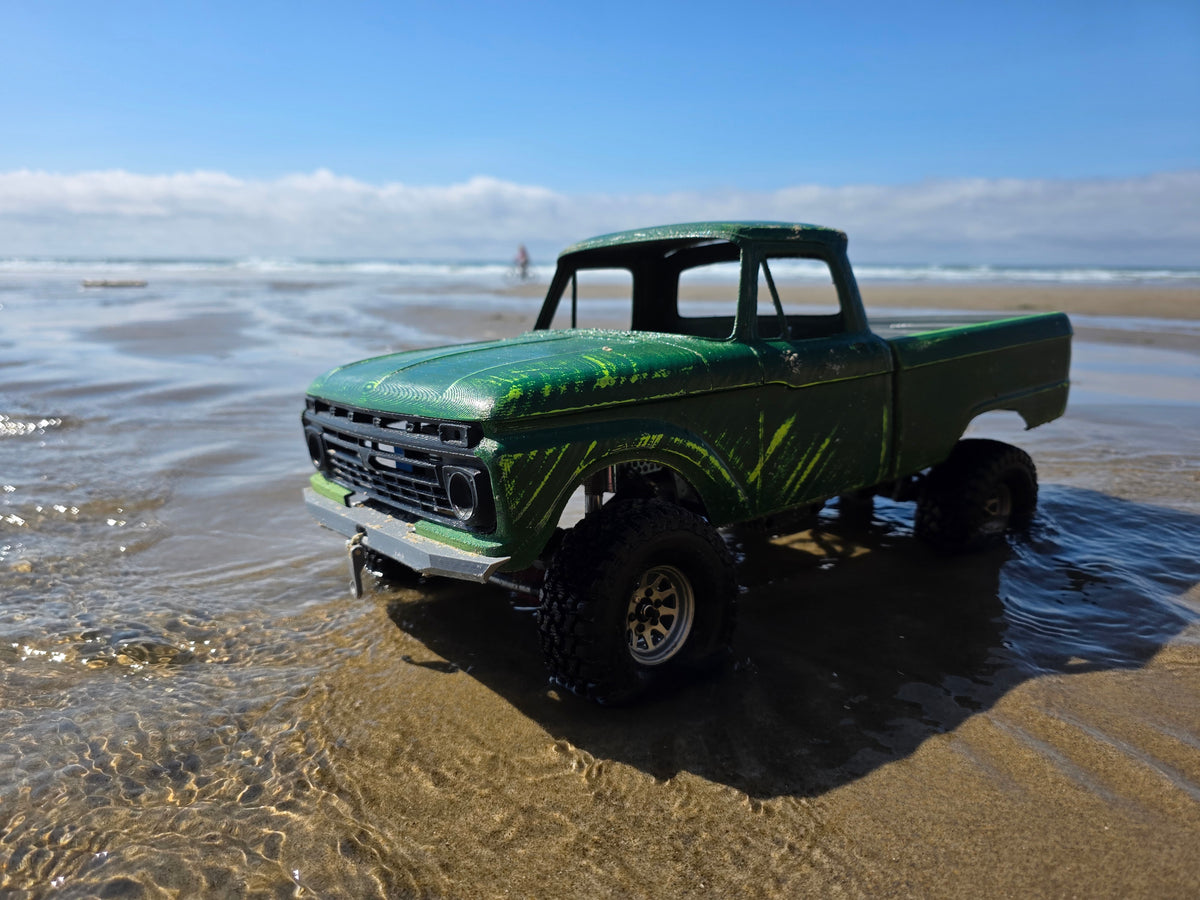 1963-66 Ford F100 painted RC body and mounts on BBV5 chassis, front quarter view on wet sand at the beach