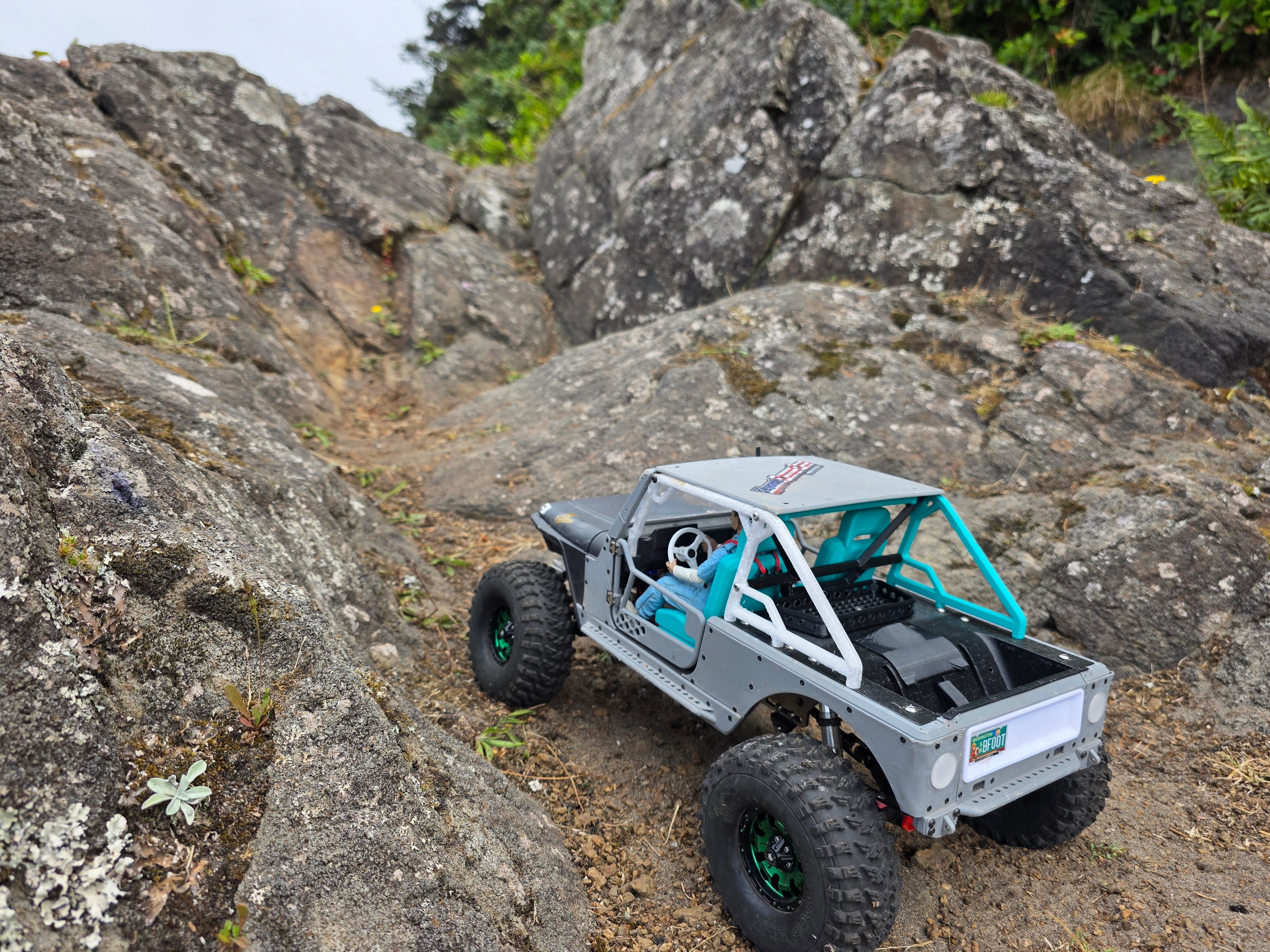 Close-up of IJ RC crawler body on Trench Knife chassis climbing rocks, Beards Hollow beach