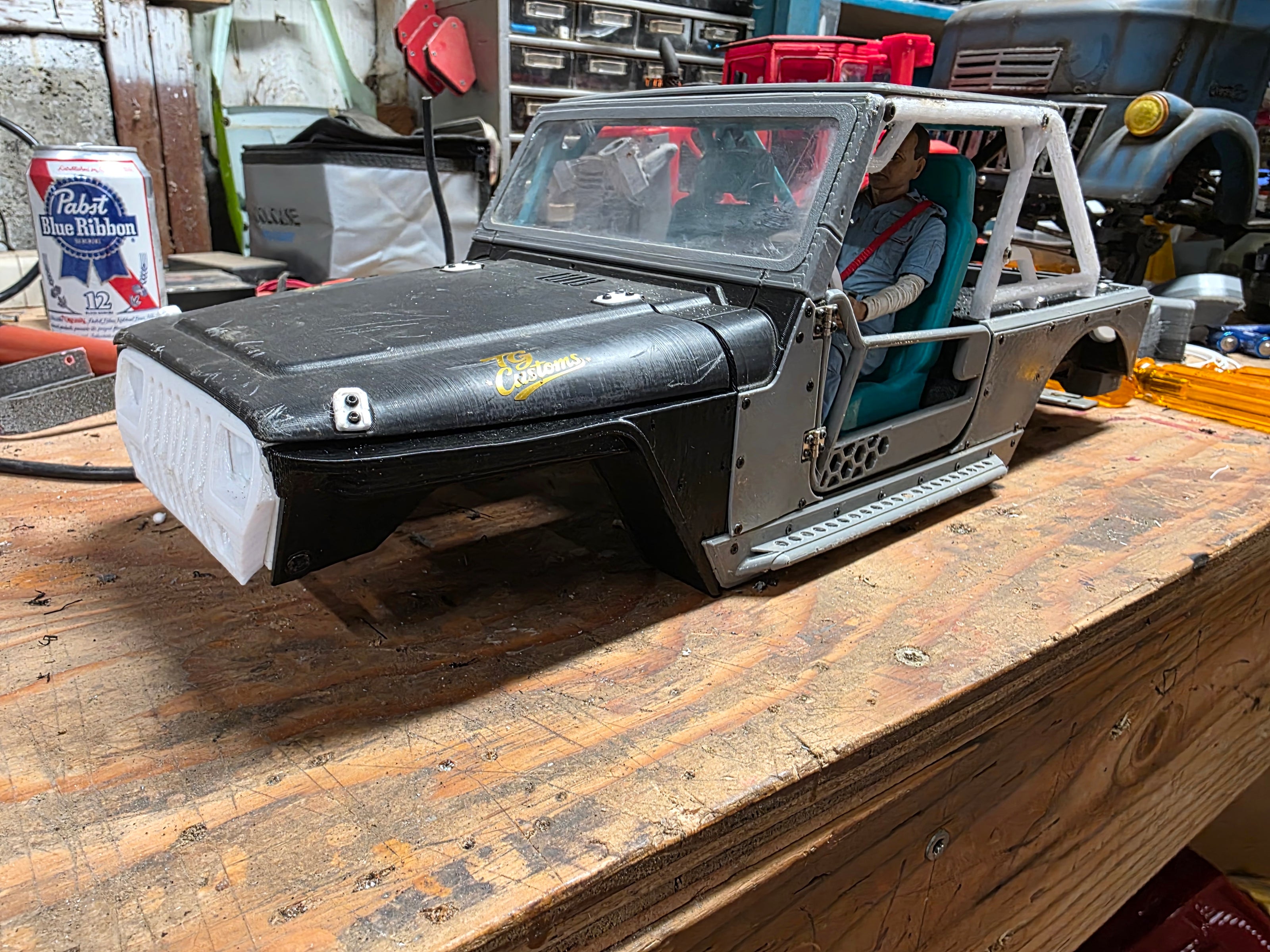 IJ-style RC crawler body repair on the bench after rock crawling at Beards Hollow